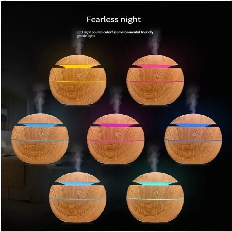 LED night light humidifier showing 7 colorful ambient lighting modes in a dark room
