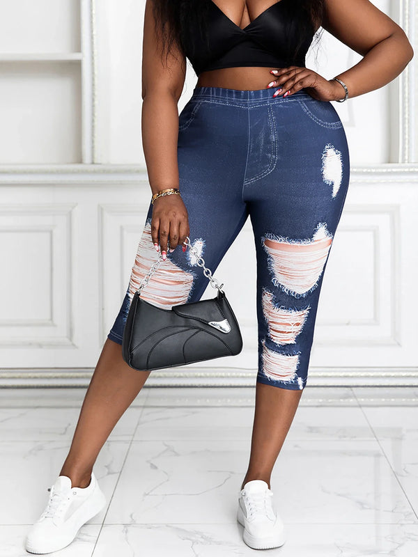 Front view of plus size women's capri pants featuring faux denim print, high-stretch fit, and distressed patches – casual summer outfit