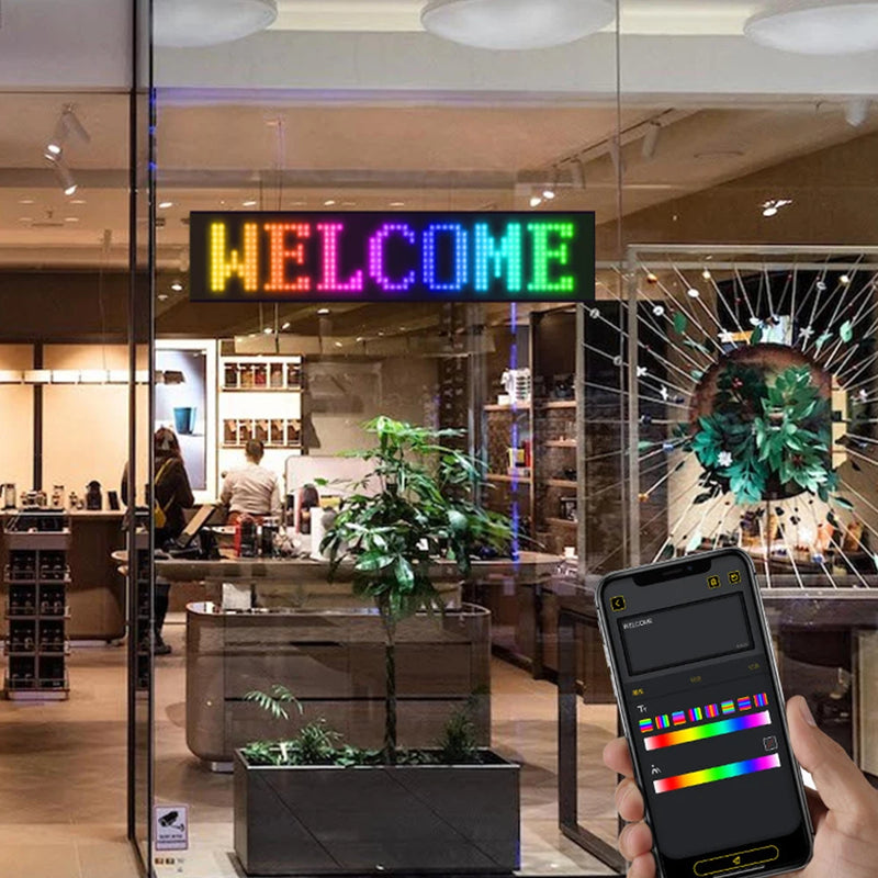 Programmable RGB LED matrix display in café window showing “FOOD” – ideal for business advertising and storefront signage