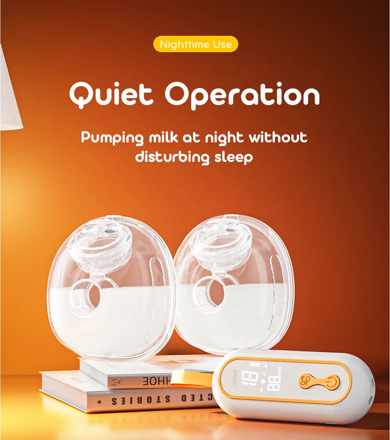 Wearable breast pump cups and controller on bedside books for quiet nighttime pumping